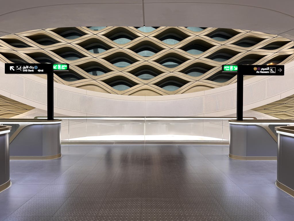 Stunning architectural design of the Riyadh Metro Station with intricate ceiling patterns and modern interiors.