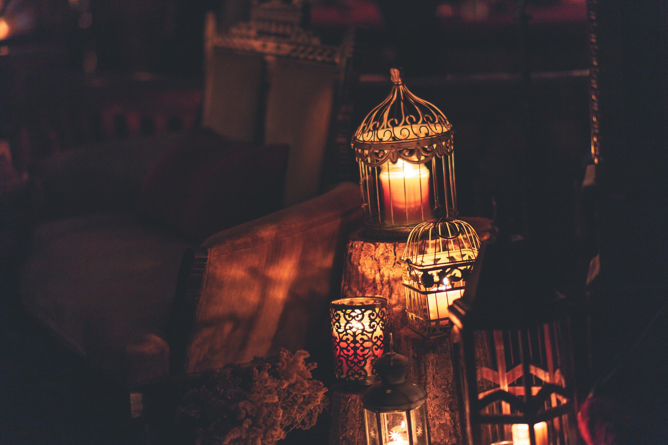 A cozy indoor scene with glowing lanterns and candles, perfect for creating ambiance.