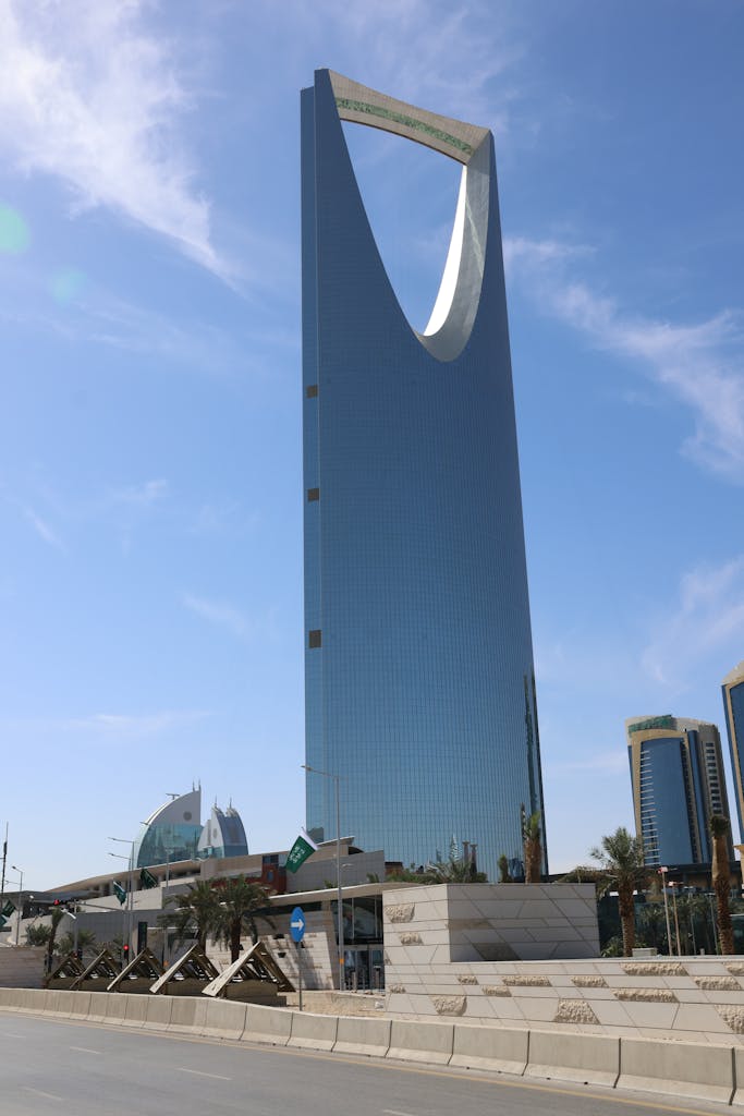 Iconic Kingdom Centre Tower under clear skies in Riyadh, Saudi Arabia.